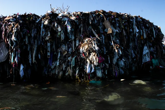 Piled-up waste, including used tires, aimed at reducing the power of the waves, pushing the sea back for "fè tè".