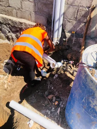 female plumber Haiti