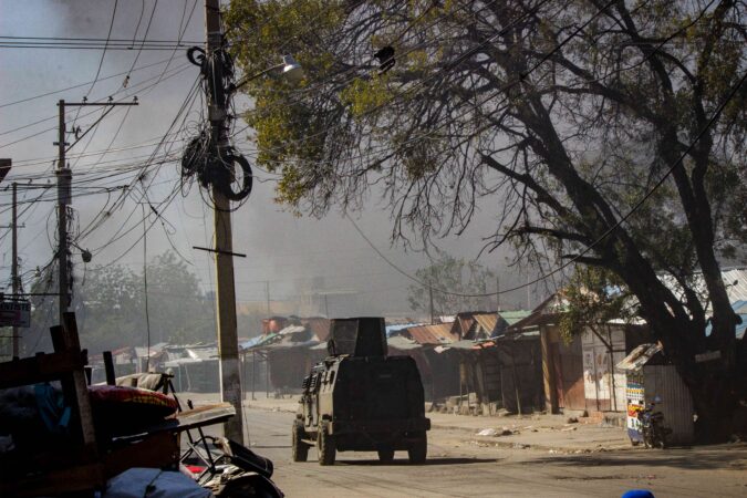 An armored police car trying to bring order to the streets of Port-au-Prince