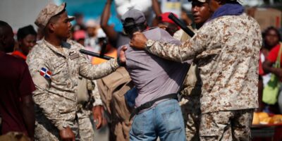 Dominican soldiers detain a Haitian who crossed the border to stock up on products, at the Binational Market in Dajabon, Dominican Republic, 15 May, 2024.EFE/ Bienvenido Velasco