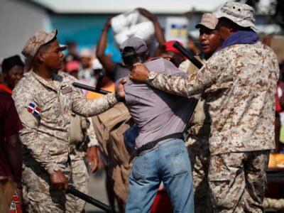 Dominican soldiers detain a Haitian who crossed the border to stock up on products, at the Binational Market in Dajabon, Dominican Republic, 15 May, 2024.EFE/ Bienvenido Velasco