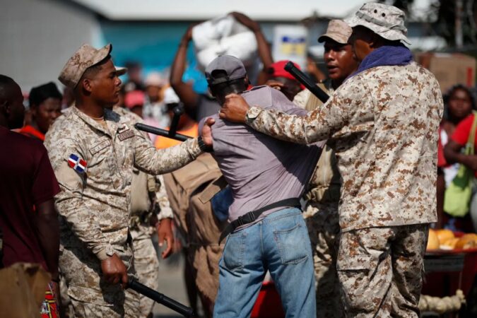 Dominican soldiers detain a Haitian who crossed the border to stock up on products, at the Binational Market in Dajabon, Dominican Republic, 15 May, 2024.EFE/ Bienvenido Velasco